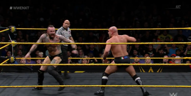 Black prepares to hit Black Mass on Aichner, during a first round Dusty Rhodes Tag Team Classic tournament match.