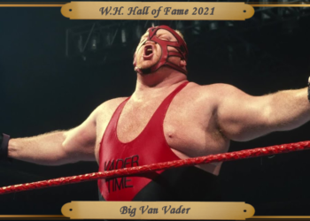 Vader, with arms outstretched, posing in the ring during his mid-90's WWF run.