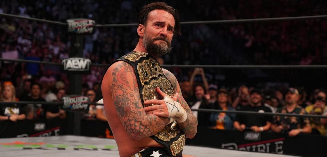 CM Punk with the AEW World Title after Double Or Nothing.