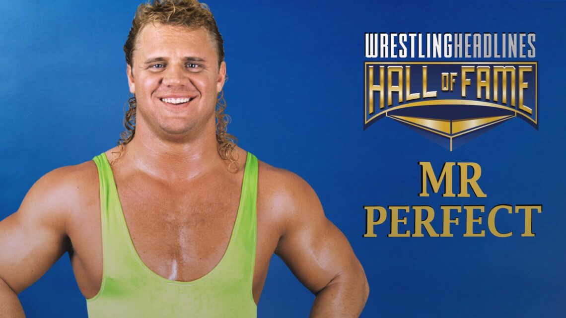 Mr. Perfect, smiling, wearing a neon green singlet, with hands on his waist, staring out with a smile, against a blue background.