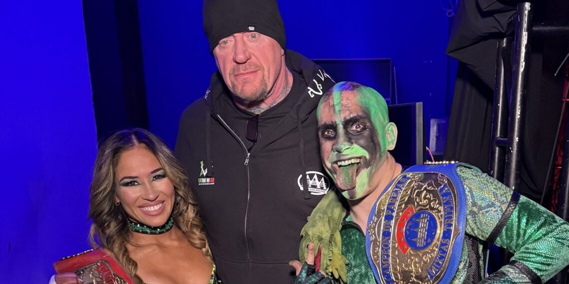 AAA Mixed Tag-Team Champions Lola Vice & Mr. Iguana with The Undertaker | Source: WWE