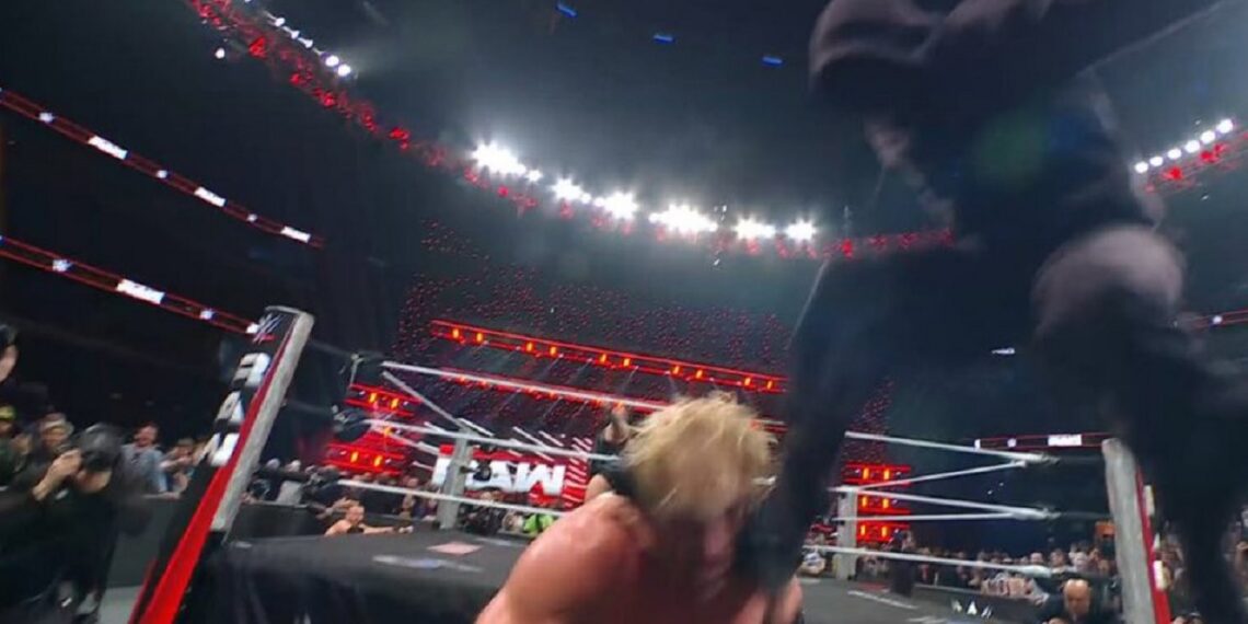 Mystery masked man attacks Logan Paul | Source: WWE