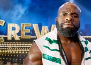 Apollo Crews in white and green WWE ring attire