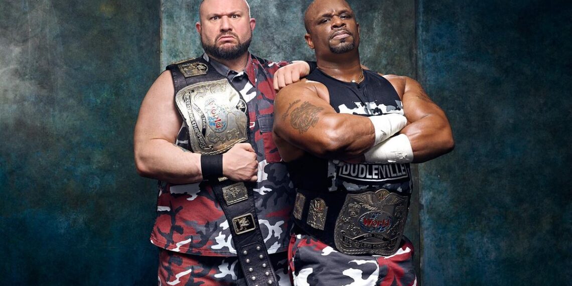 D-Von Dudley, right, with Bubba Ray Dudley and their tag team titles