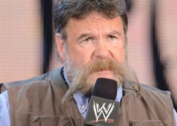Dutch Mantell holding a microphone during a WWE appearance