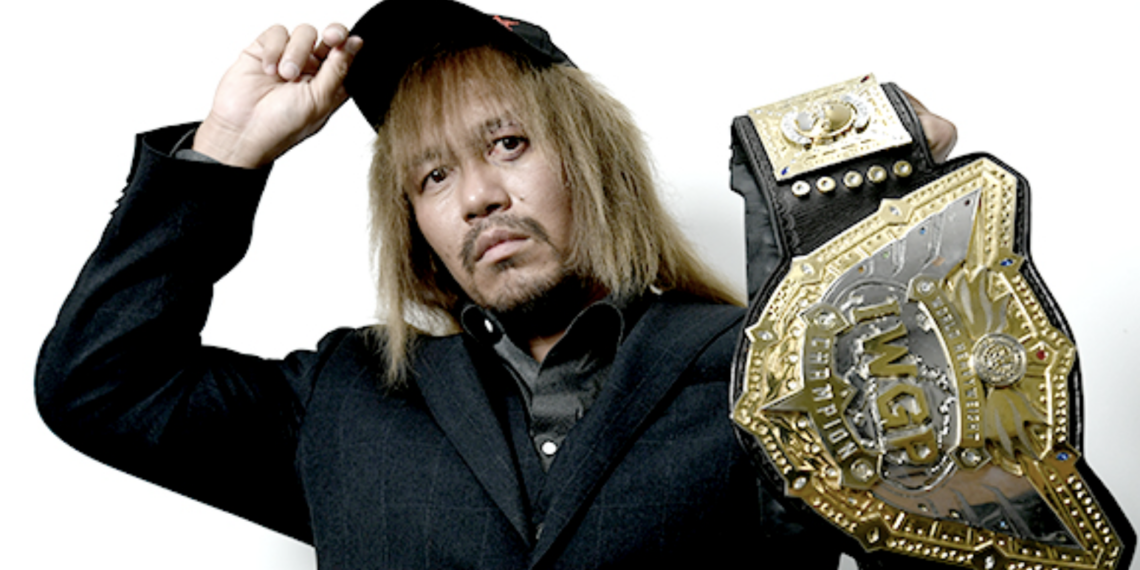 Tetsuya Naito holding the IWGP World Heavyweight Championship in an archival photograph