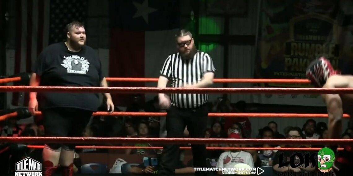 Sam Stackhouse on the left during a wrestling match