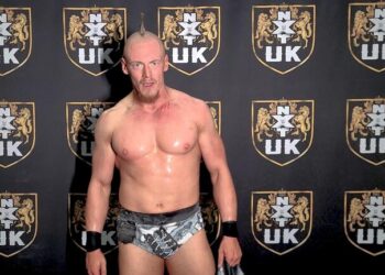 Sam Gradwell in front of the WWE NXT UK backdrop