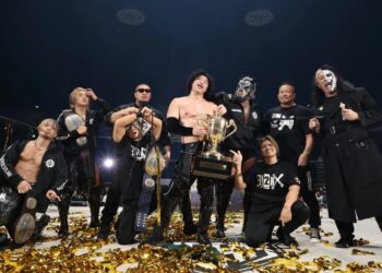 OZAWA holds the N-1 Victory trophy beside members of Team 2000X at NOAH's October 4, 2026 event.